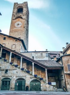 an old building with a clock tower in the background