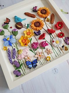 a white tray with flowers and butterflies on it