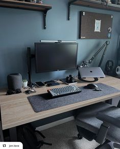 a computer desk with a keyboard, mouse and monitor sitting on it's side