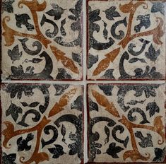 four square tiles with different designs on them