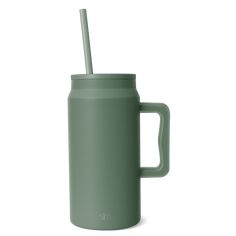 a green mug with a straw in it