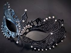 This captivating set includes two stunning masks, both designed in the classic Venetian style. The mask is adorned with sparkling rhinestones, reflecting the light and adding a touch of enchantment to her look while the black mask includes shimmer and exudes strength and sophistication, making him a charismatic presence at any masquerade or other special events.


Age Group/Gender - Adult/Unisex

Size/Type - One size fits all adults

Mask Color - Black
Mask Material - Metal women's, polyresin me Elegant Black Masks And Prosthetics For Party, Elegant Black Party Masks And Prosthetics, Elegant Black Eye Mask For Masquerade, Elegant Black Formal Mask, Elegant Black Masks For Carnival, Gothic Evening Masquerade Eye Mask, Elegant Black Mask For Costume Party, Gothic Eye Mask For Evening Masquerade, Elegant Black Masks And Prosthetics For Evening