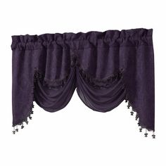 a purple curtain with tassels hanging from it's side and an attached valil