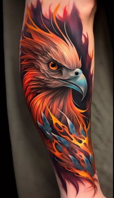 an eagle tattoo on the leg with fire and flames coming out of its wings,