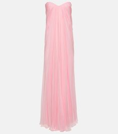 a pink dress on a mannequin neckline, with straps and pleating