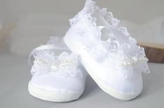 Beautiful baby lace shoes with bow and a little lace bow. Making Process: Baptism shoes are made from comfortable and soft felt, satin and lace. This beautiful pair of dainty baby shoes are finished with a little lace bow. Occasion: Perfect for wedding, christening, baptism, naming ceremony and any other occasion. UNIQUE GIFT IDEA for a new baby. Measurements: Those baptism shoes are available in three baby sizes. Please choose from the options. 9cm sole   0-3m 10cm sole 3-6m 11cm sole  6-9m Ple Baby Lace, Bow Wedding, Newborn Shoes, Lace Shoes, White Booties, Naming Ceremony, Third Baby, Bow Making, Lace Bows