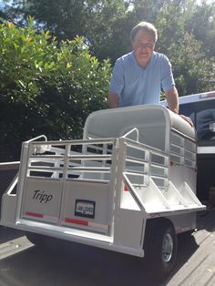 a man standing in the back of a truck