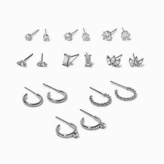 Variety is the spice of life and the goal of this earring set, which includes nine different pairs of earrings. Styles include six cubic zirconia studs and three embellished hoop design.Pack Size: 9 pairsFinish: Silver-toneSensitive Solutions Closure: Post backMaterial: Metal, Cubic zirconia - Claire's Silver-tone Cubic Zirconia Glitz Mixed Earrings Set - 9 Pack Mixed Earrings, Earrings Pack, Earring Pack, Piercing Kit, Hoop Design, Fashionable Jewelry, Birthday Wishlist, Demi Fine Jewelry, Jewelry Cleaner