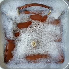 an ice bucket filled with brown and white stuff