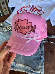 The Pink Desert Trucker Hat is a playful accessory that captures the essence of sunny adventures! Featuring a vibrant pink color and a classic mesh-back design, this hat is perfect for adding a pop of fun to any outfit. Whether you're hitting the trails or just enjoying a day out, it's the perfect way to stay stylish and shaded! One Size Fits Most White Pearl Bow Hat Chain NOT included Hat Chain, Pink Desert, Pearl Bow, Purse Accessories, Plus Size Shopping, Boys Jacket, White Pearl, Hat Sizes, Long Sweaters