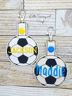 two personalized key chains with soccer balls on them