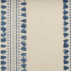 a blue and white striped fabric with fringes on the edges, in two rows