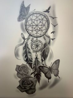 a drawing of a dream catcher with butterflies and roses on the bottom half of it