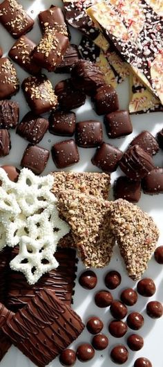 assorted chocolates and candies on a white plate