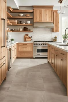 a kitchen with wooden cabinets and tile flooring