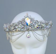 This stunning Mermaid Crystal Crown is a mesmerizing headpiece perfect for fantasy weddings, cosplay, or special occasions.  Designed with iridescent crystals, shimmering rhinestones, and intricate metalwork, this tiara captures the ethereal beauty of the ocean.  Ideal for brides, festival-goers, and lovers of boho style, the crown's sparkling elements reflect light in a rainbow of colors, creating a magical, captivating look.  The design is lightweight, comfortable, and adjustable, making it easy to wear all day. Lunar Wedding, Ocean Crown, Sea Crown, Mermaid Tiara, Steampunk Book, Beach Bachelorette Party, Wedding On The Beach, Mermaid Stuff, Beach Bachelorette