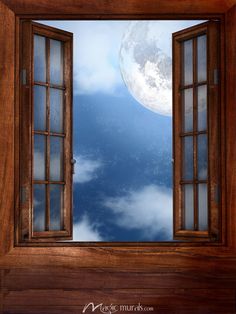 an open window looking at the moon and clouds