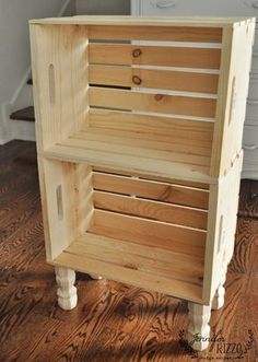 a wooden shelf with drawers on top of it in the middle of a wood floor