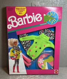 the barbie doll is wearing a green sweater and pink pants with leopard print on it