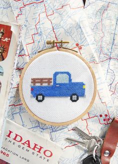 a blue truck is shown on a map with scissors and other items to sew