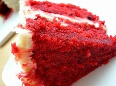 a slice of red velvet cake on a white plate