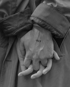 a person's hand with the word hope tattooed on it