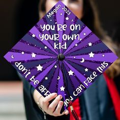 a purple graduation cap with white stars and the words you pep on your own kid