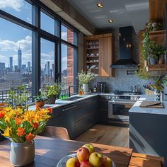 a kitchen with large windows overlooking the city and flowers in vases on the table