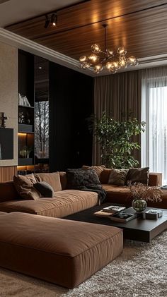 a living room filled with lots of brown furniture