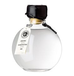 a white bottle with a black cap on it's top and label hanging from the side