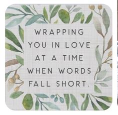 two coasters with words and leaves on them, one saying wrapping you in love at a time when words fall short