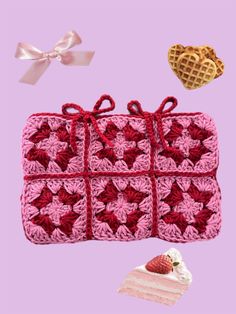 a crocheted purse with hearts and a piece of cake next to it on a pink background