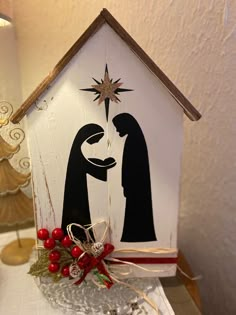 a nativity scene is displayed on a table