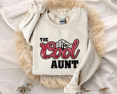 The Cool Aunt Shirt, Aunt Gift, Mothers Day Shirt, Gift for Her, Fantastic Sister Shirt, Cool Aunt Tee, The Cool Aunt T-Shirt --- HOW TO ORDER --- 1 - Please make sure you have read and looked at all sizes and chosen the color that best suits you. 2 - Select from the various T-shirt sizes. 3 - Select from the various T-shirt color. 4 - ADD your personalized design/text color or text in the box IF provided. 6 - Add to cart. ---PRODUCTION AND SHIPPING--- - Your order will be ready to ship next bus The Cool Aunt, Cool Aunt, Aunt Shirt, Aunt T Shirts, Gifts For Aunt, Aunt Shirts, Sister Shirt, Teenage Daughters, Design Text