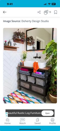 a bathroom sink sitting next to a mirror on top of a wooden shelf with baskets underneath it