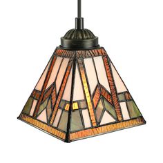 a stained glass hanging light fixture with an orange and green design on the bottom half