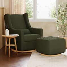 a living room with a green chair and footstool next to a small table