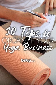 a woman writing on a notebook with the title 10 tips to organize your yoga business