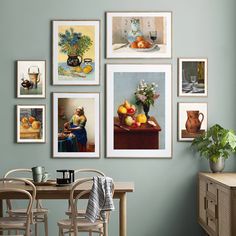 a dining room table with chairs and pictures on the wall above it that have vases in them