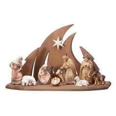 the nativity scene is made out of wood and features figurines of people