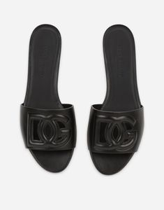 5 mm - 0.2 inches leather-covered heel Calfskin insole with branded label Smooth leather sole with logo Item comes with themed packaging Made in Italy Dolce And Gabbana Slides, Logo Feminine, Shoes Slides, Women Slides, Black Slides, Logo Items, Womens Slides, Dolce E Gabbana, High Frequency