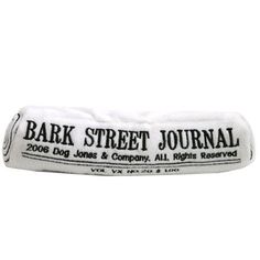 the back of a white pillow with black lettering that says bark street journal on it