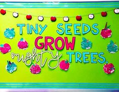 a sign that says tiny seeds grow mighty trees on the side of a green wall