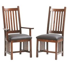 two wooden chairs with black leather seats on white background, one is made of wood and the other has dark brown leather upholsterling