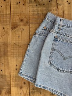 "High waisted 90's denim shorts. Made by Levi's in light blue denim wash. Shorts are in great clean condition. Perfectly worn in with light naturally distressed character. Measurements are taken zipped or buttoned up and laid comfortably flat then x 2 for total circumference (inches) Tag Size 12 Levis 941 100% Cotton Waist 33\" Hips 43\" Length 14\" Inseam 3.5\" Rise 11\" leg opening circumference 25.5\" All items are free of rips, tears, holes, and stains unless otherwise noted." Vintage Jeans With Built-in Shorts For Spring, Vintage Medium Wash Straight Leg Shorts, Retro Light Wash Short Jeans, Retro Straight Leg Jean Shorts With Pockets, Vintage High Rise Denim Blue Shorts, 90s Inspired High Rise Denim Jean Shorts, Retro Light Wash Short Bottoms, 90s Denim Jean Shorts, 90s Style Denim Blue Shorts