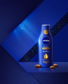 a bottle of nivea on a blue and black background with almonds in the foreground