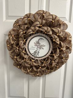 a decorative wreath hanging on the front door