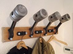 there is a coat rack with many different items on it