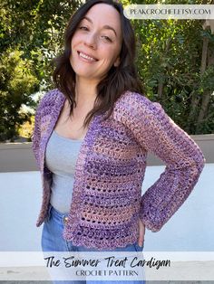 a woman wearing a purple crochet jacket and smiling at the camera with her hands on her hips