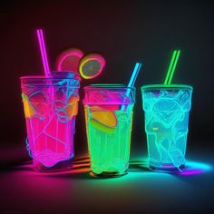 three neon colored drinks with straws and lemon slices